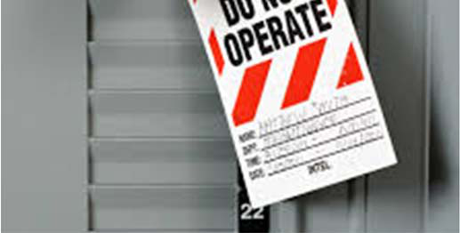 Lockout/tagout padlock and warning tag marked “Danger” and “Do Not Operate” attached to equipment.