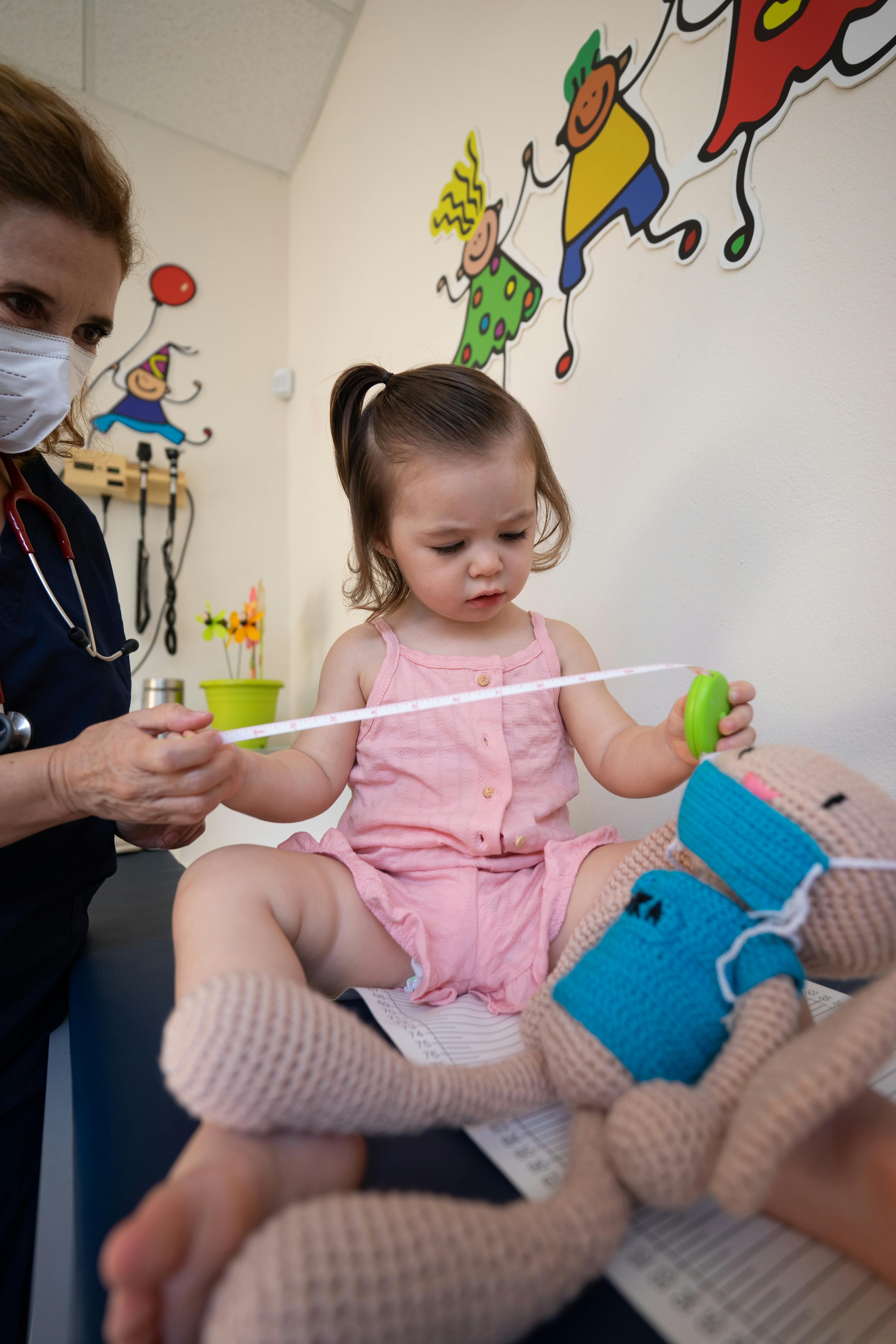 Child with doctor in doctor's office