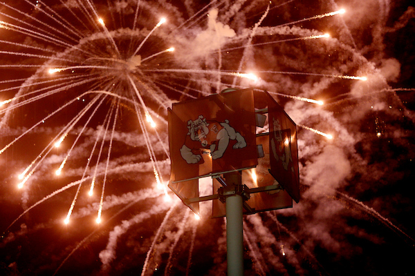 Fresno State Bulldog logo with fireworks in the background